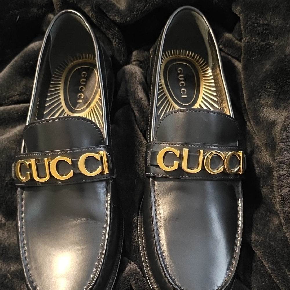 Gucci Black and Gold Leather Slip-Ons